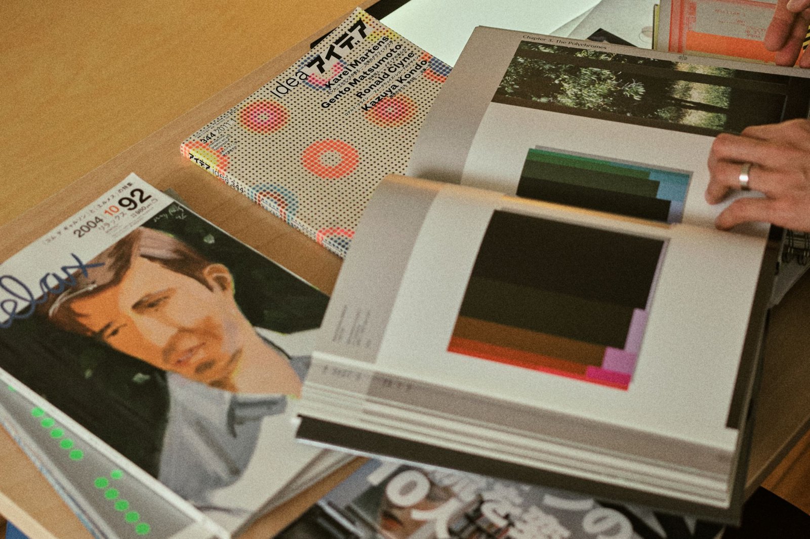 An issue of Idea magazine featuring Karel Martens on its cover, beside an open book of color studies and a Relax magazine