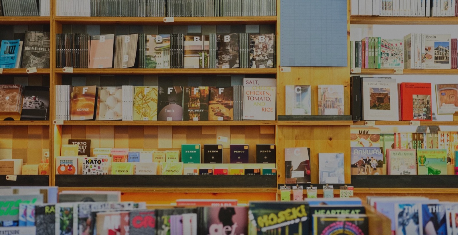 Floor-to-ceiling shelves of magazines, zines and art books at Heath newsstand