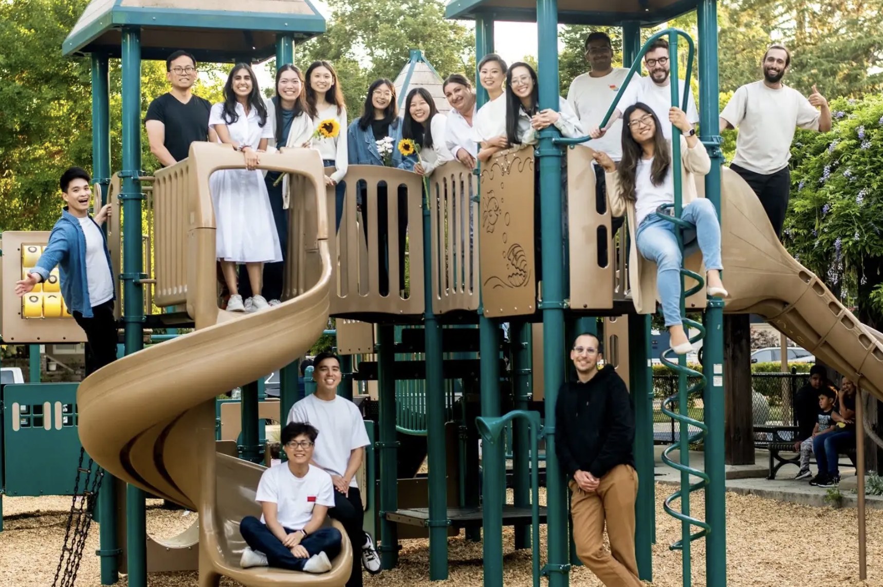 The Simile team posing on a playground structure